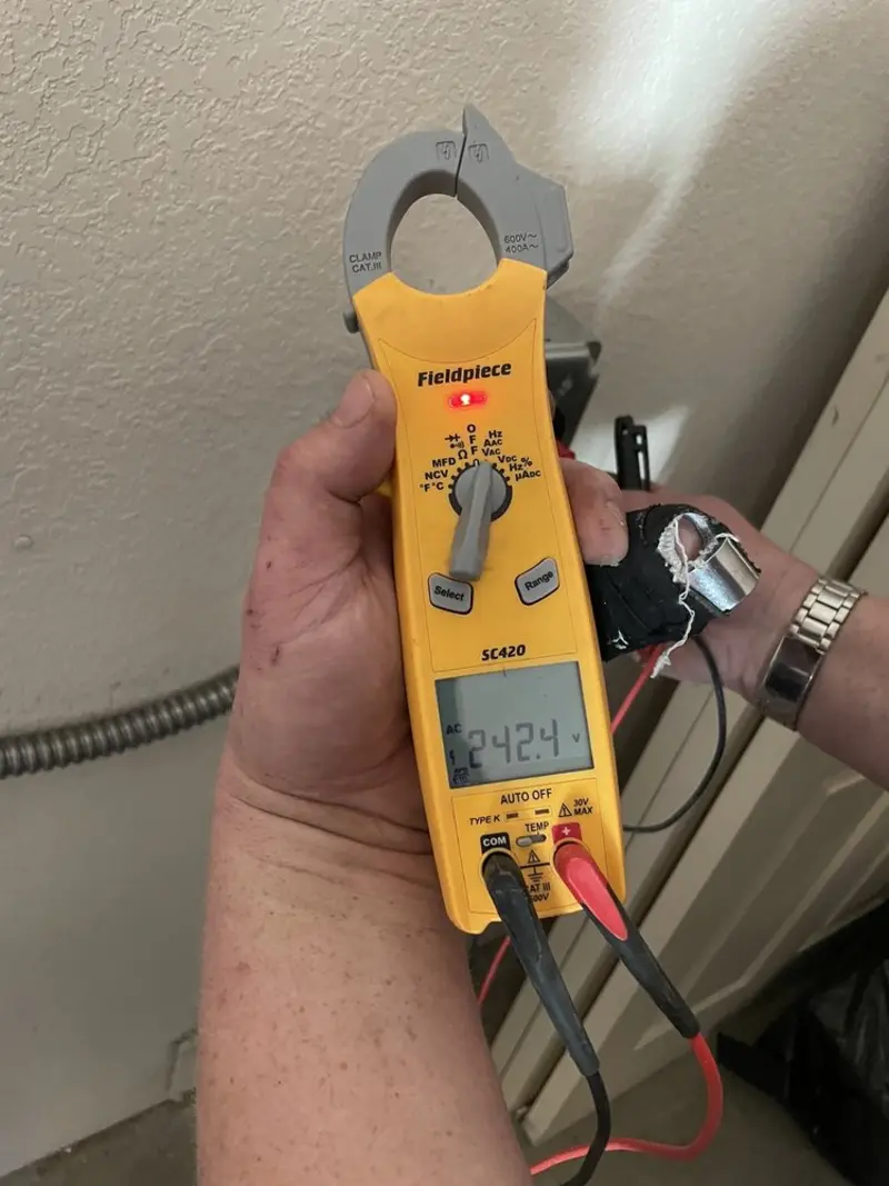 Voltage testing with clamp meter during Recessed Lighting Installation in Islandia